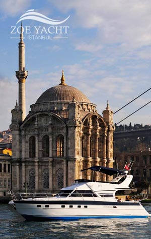 Photo of the boat on a Bosphorus tour passing Ortakoy Mosque in Istanbul Turkey